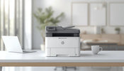 Modern HP all-in-one office printer on a clean minimalist desk